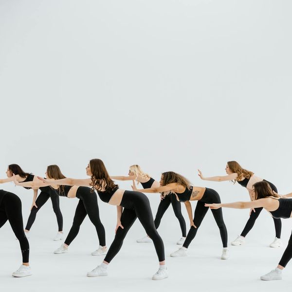 Group of people of different ages enjoying a yoga class together.